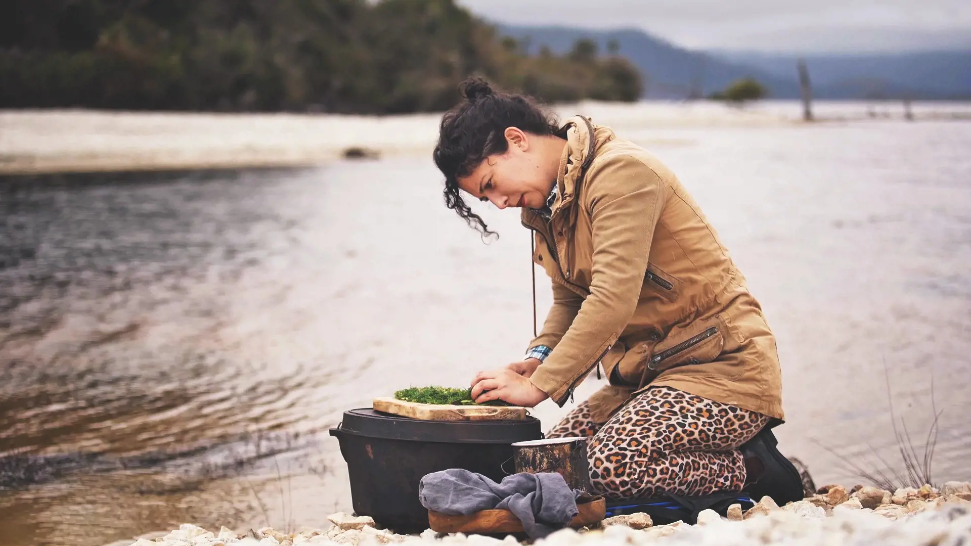 Analiese Gregory cooking near water