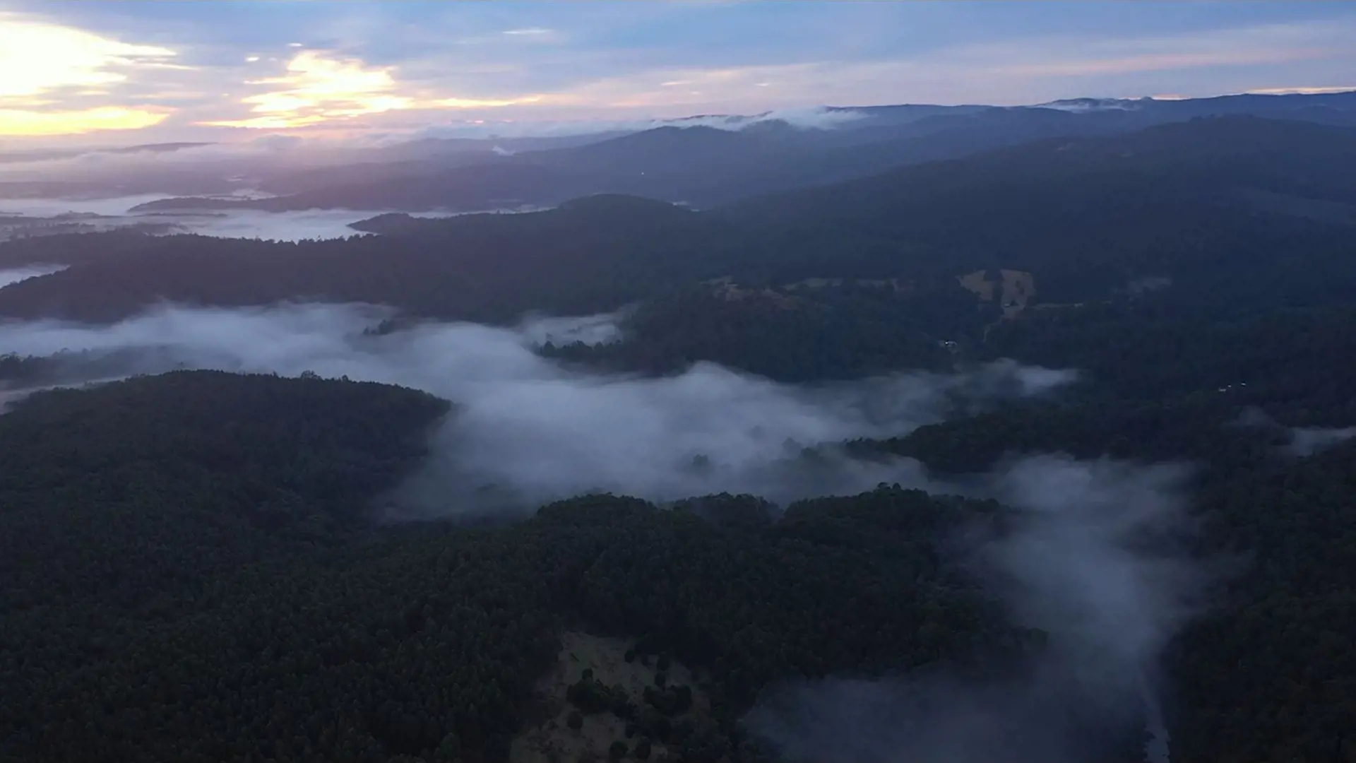 A mountain vista covered low-level cloud.