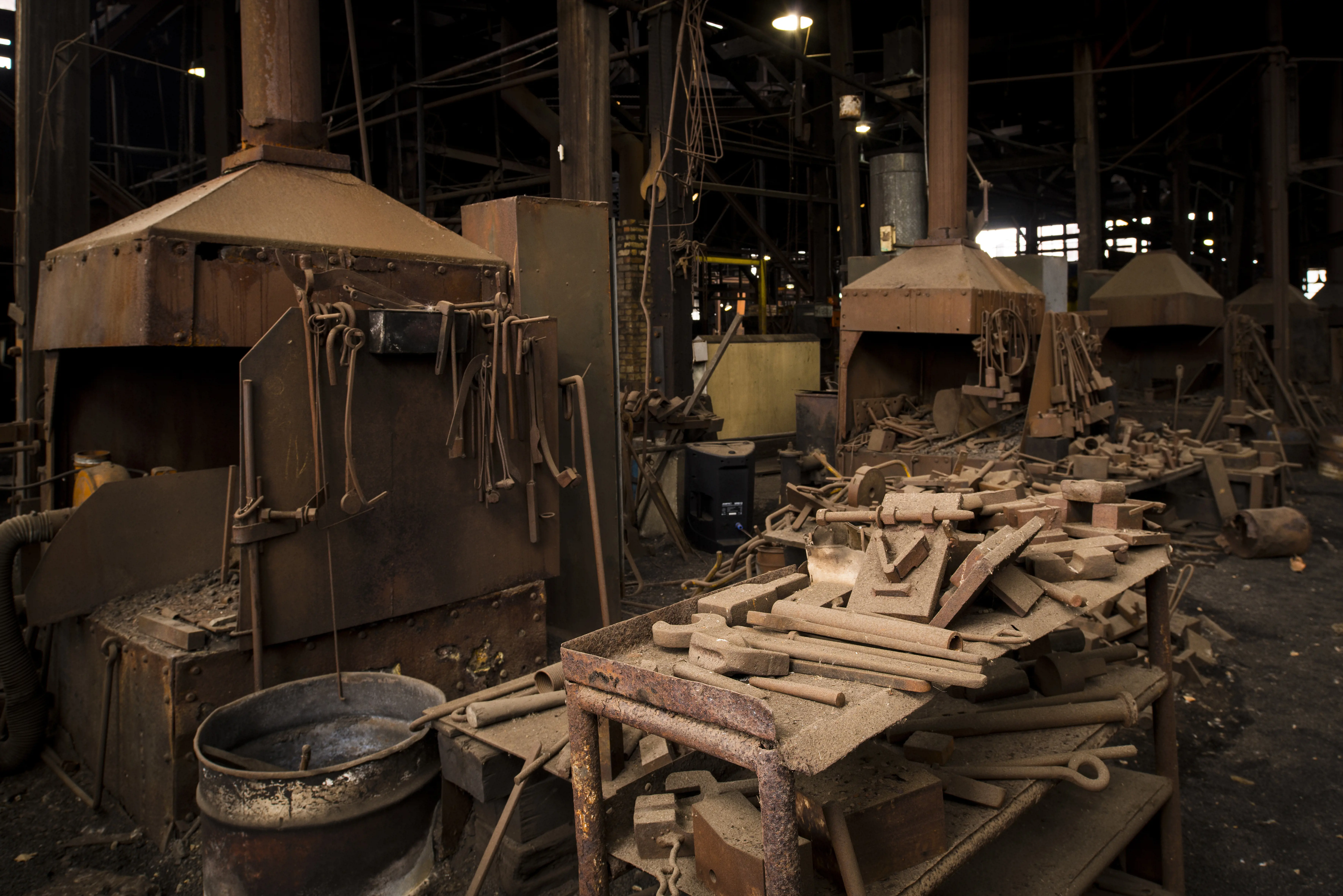 An industrial shed with old machinery and tools.