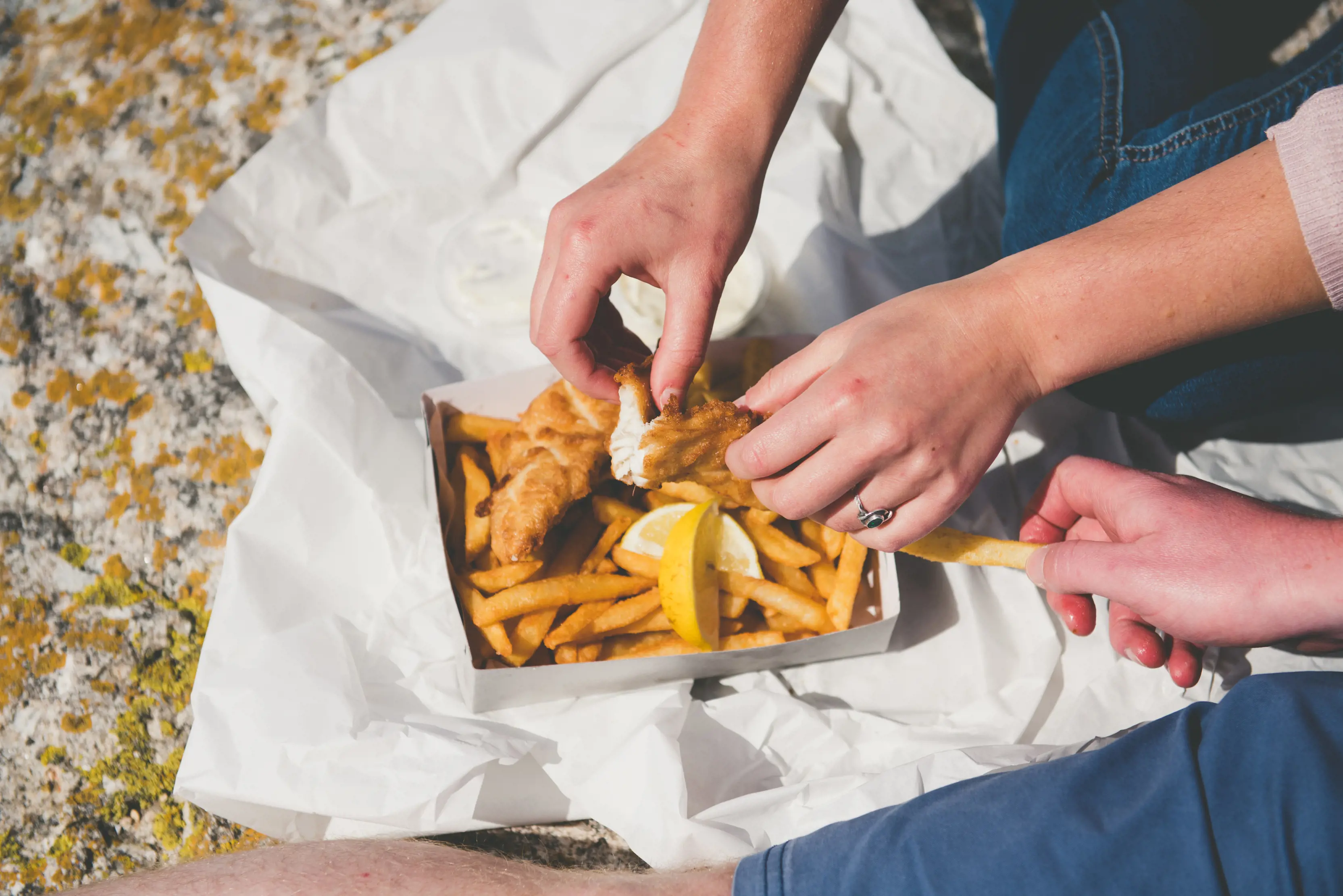 "Couple eating fish and chips in Bicheno. "