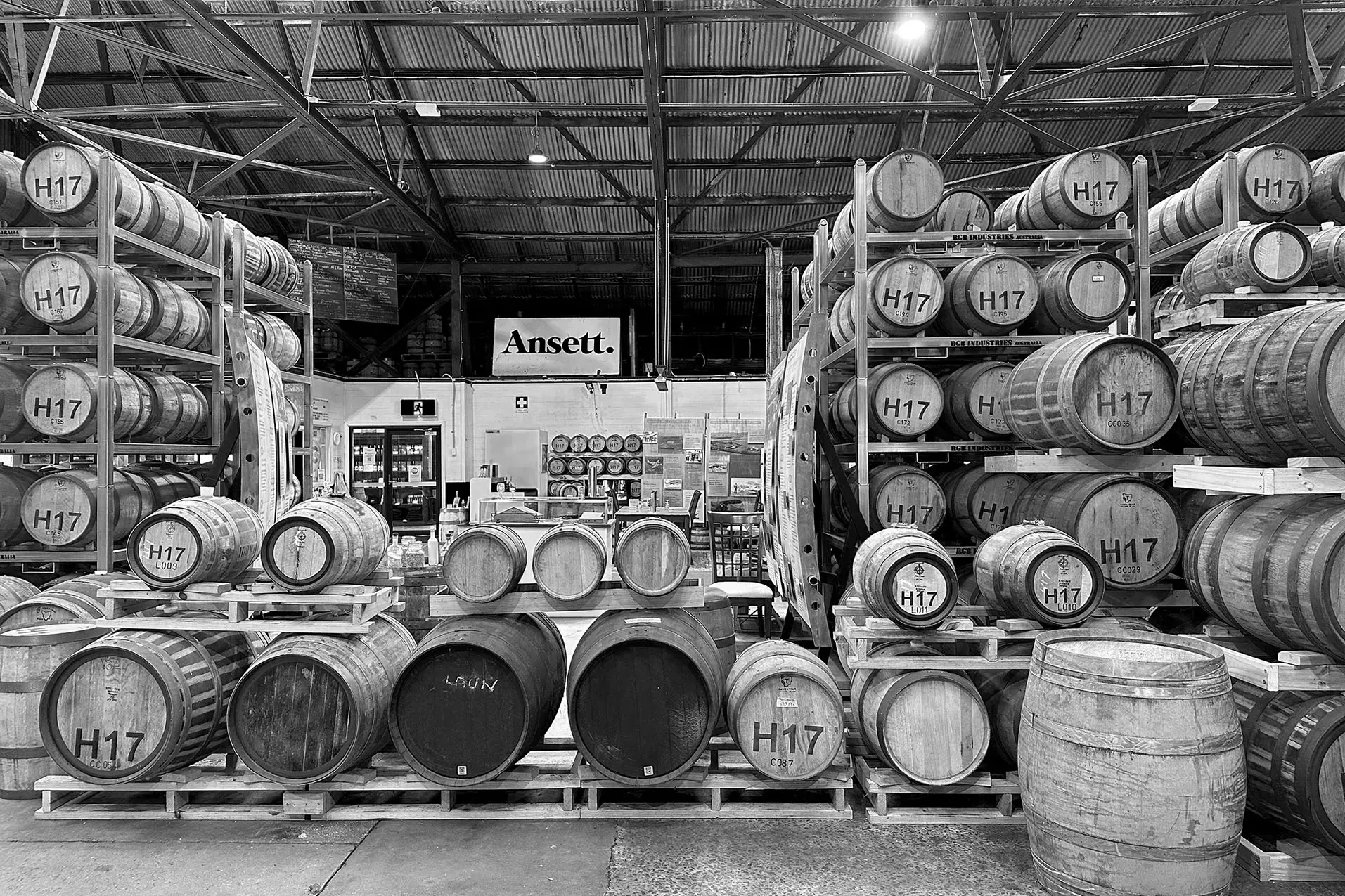 Rows and rows of metal shelving, all stacked with whisky barrels of various sizes. They are all labeled with 'H17'.