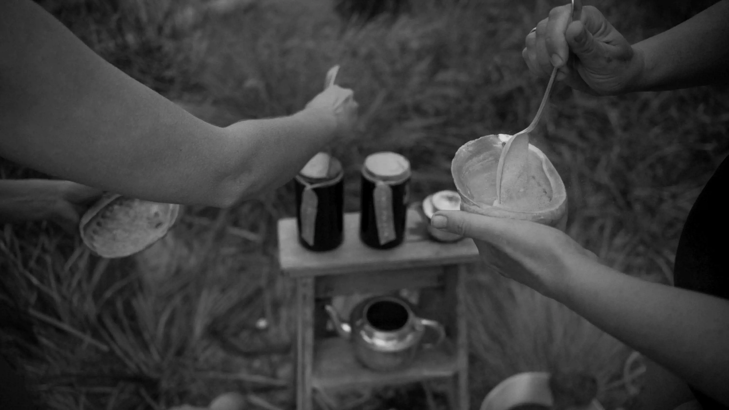 People prepare body scrub from a thick paste mixed with sand and place it into large empty abalone shells.