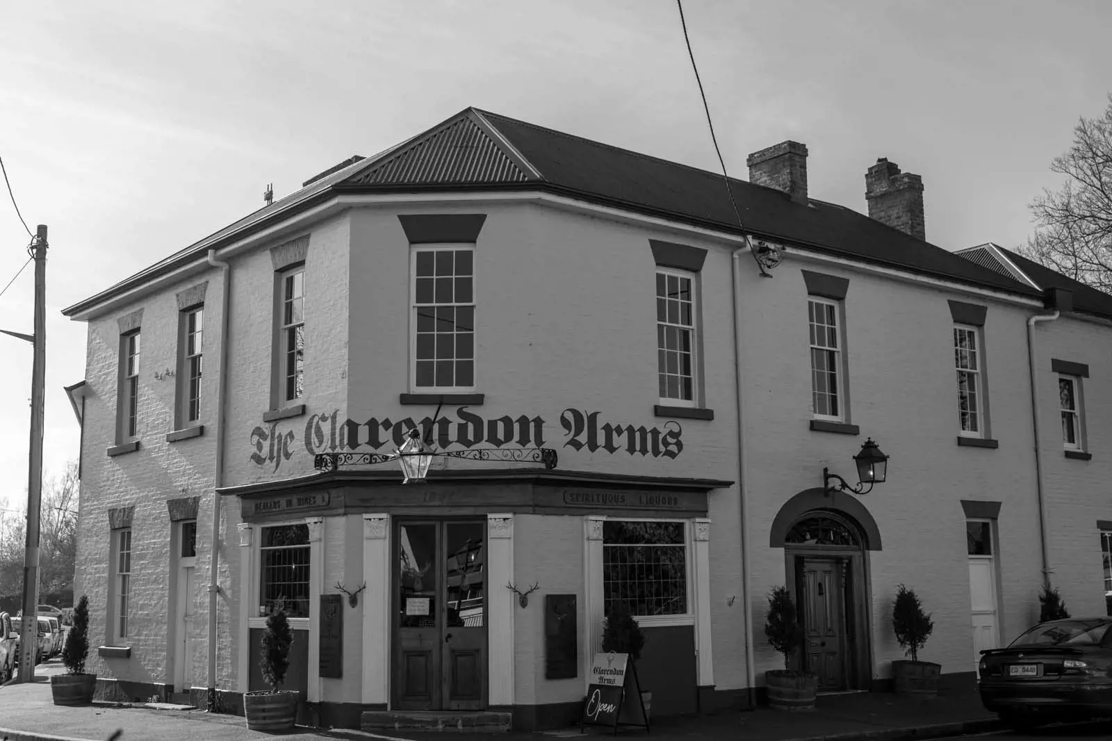 A white brick heritage corner pub, with 'The Clarendon Arms' above the front door in antique lettering.
