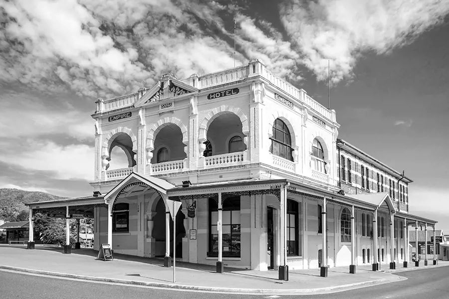 Exterior view of the Empire Hotel in Queenstown, its classic façade standing proudly against a cool, grey winter sky.