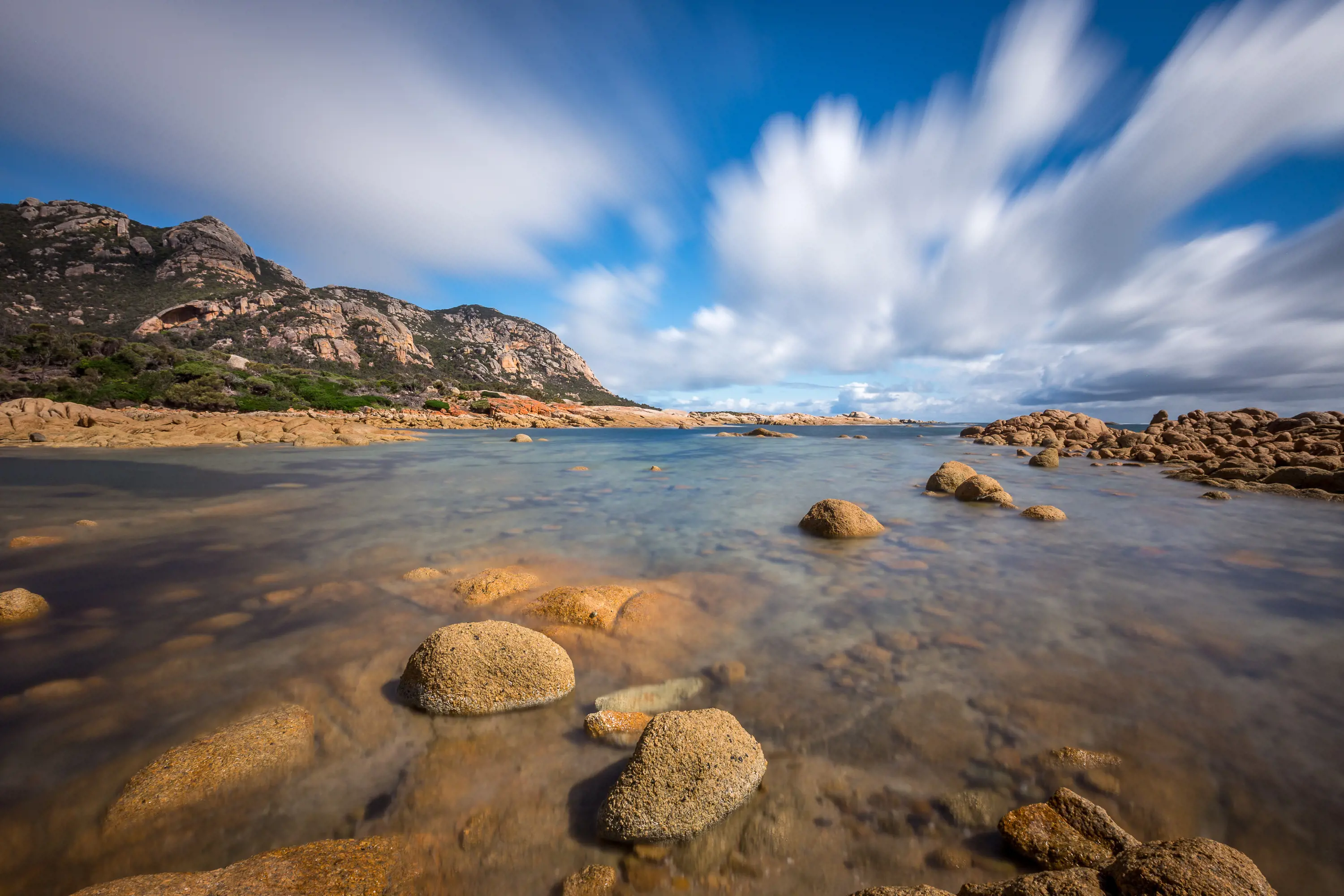 Incredible wide angle image of The Dock, Flinders Island on a clear, sunny day. Where the mountains meet the coastline.