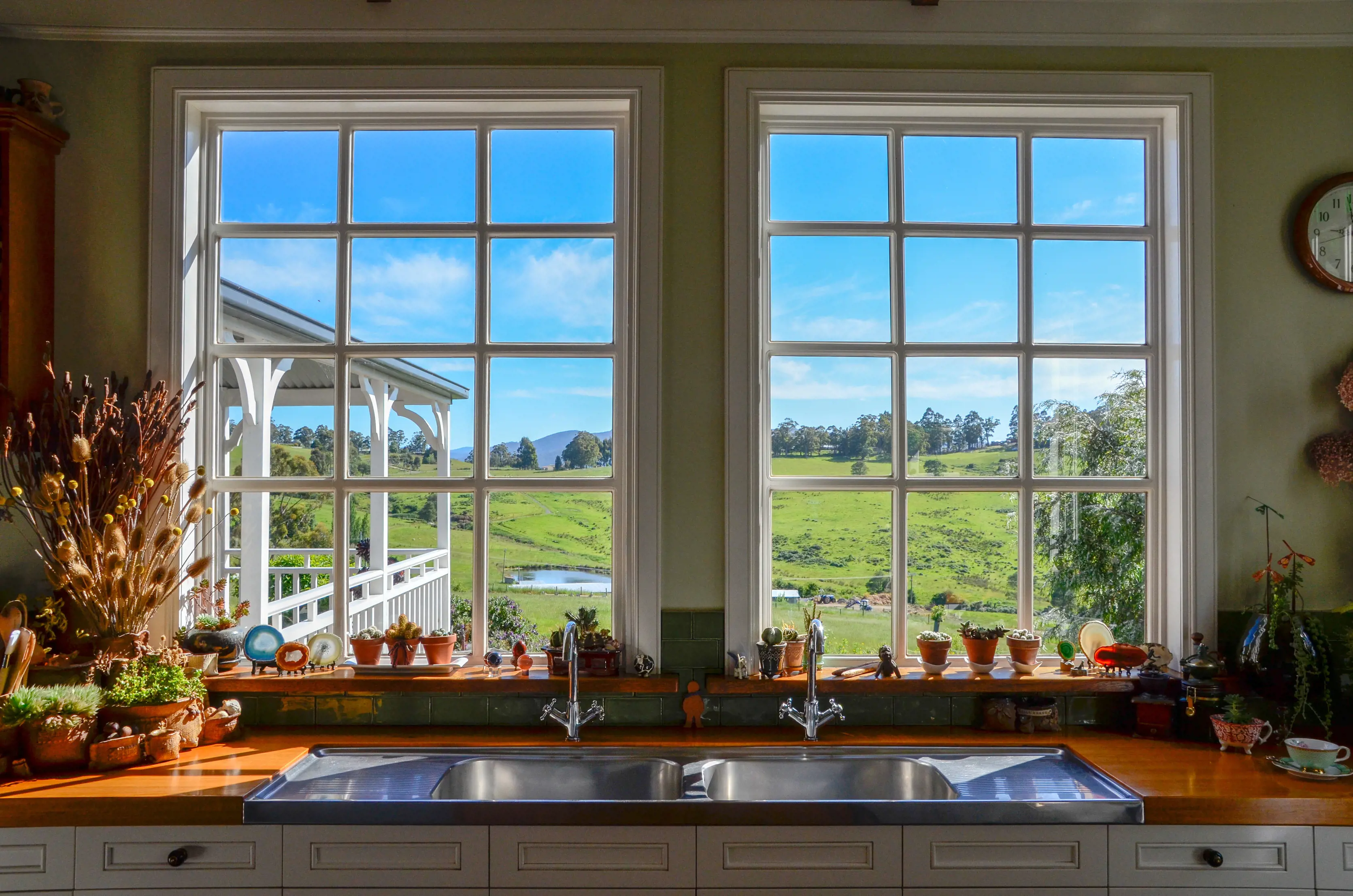 Stunning view through the window from the The Farmhouse Kitchen, nestled in the lush green hills of Wattle Grove.