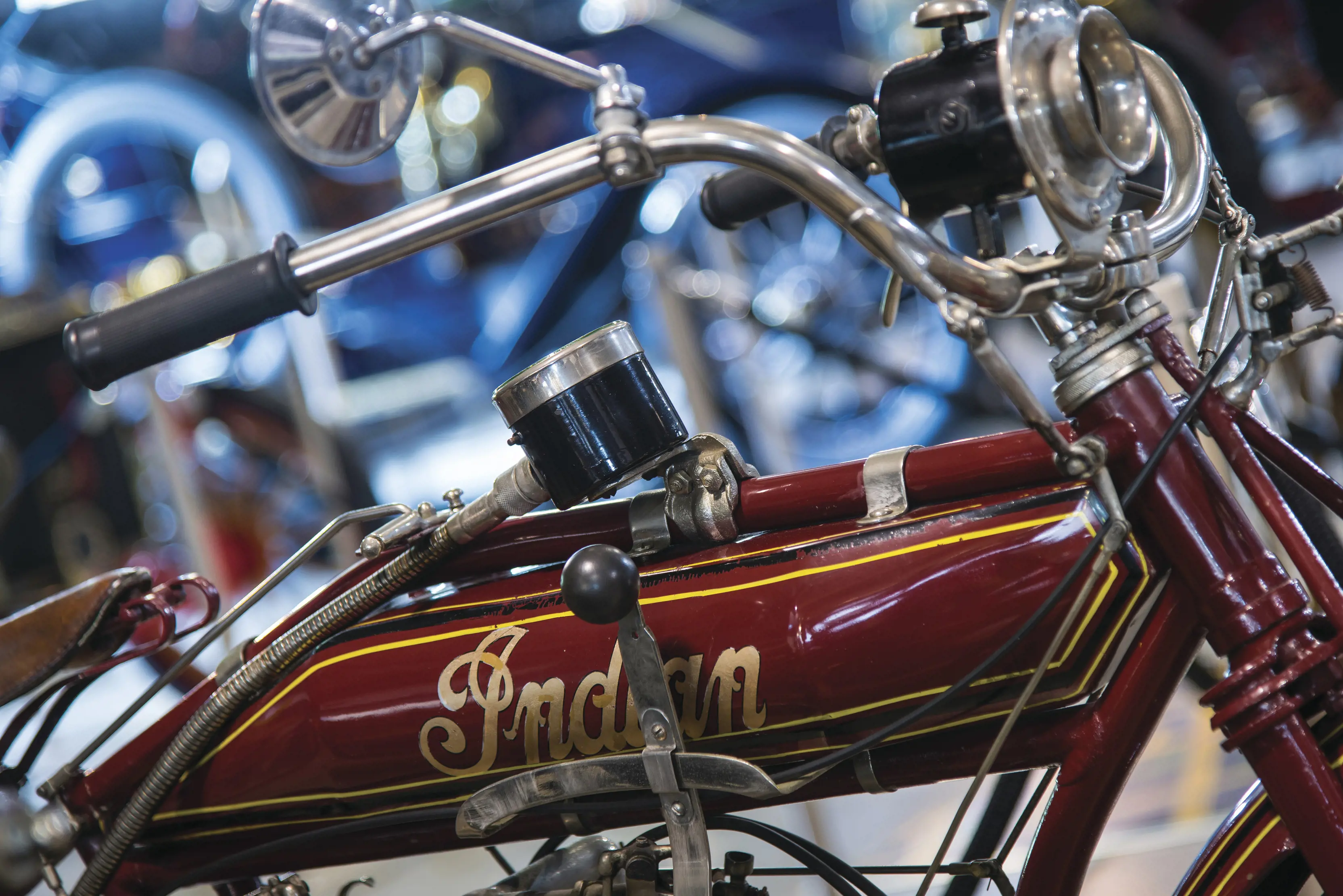 Close up image of a maroon coloured, vintage "Indian" motorcycle. Apart of the Wonders of Wynyard - Ransley Veteran Ford Collection.