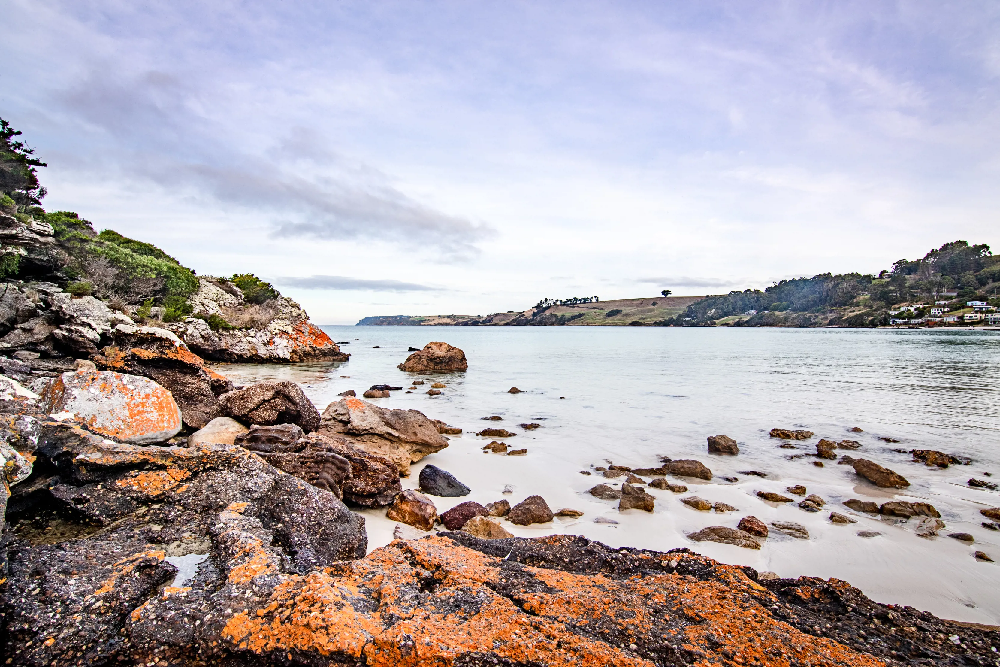 Rocky shoreline of Boat Harbour on a clear day.